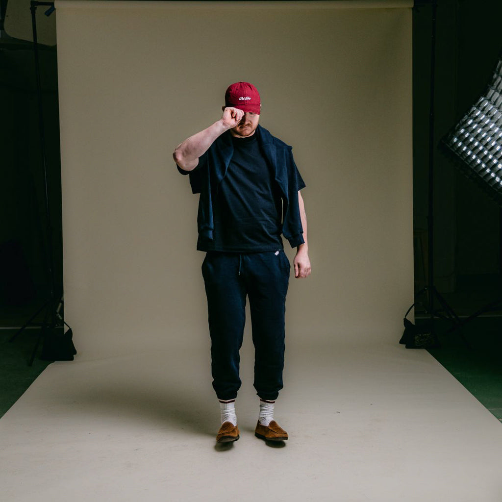 Retro Gym Sweatpants in Navy — styled studio view