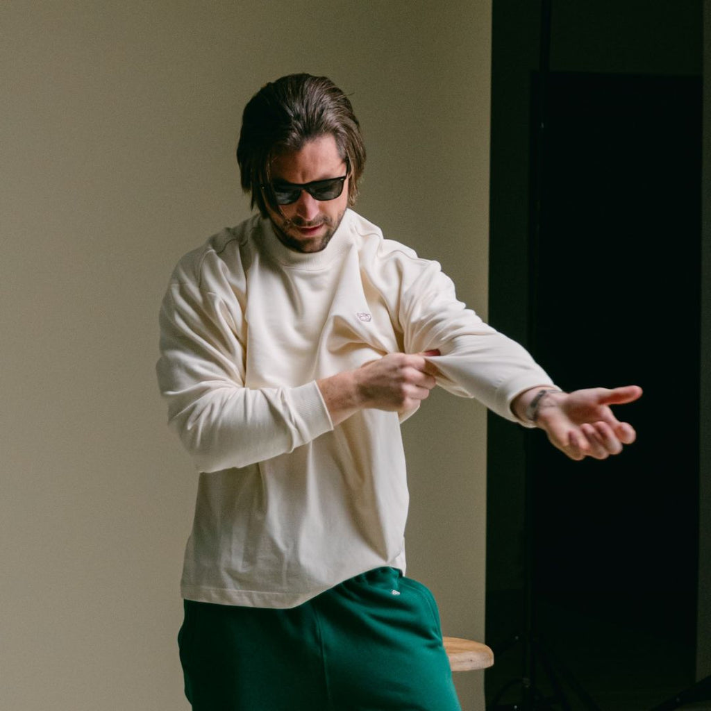 Retro Gym Crewneck Sweatshirt in Vintage White — styled studio view